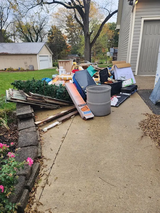 Dumpster being loaded with debris for 30 Yard Dumpster Rental in Blackfoot